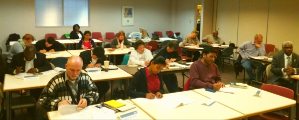 Four Seasons Toastmasters Club completing feedback forms for a speech