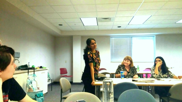 Toastmasters meeting guest Ramya stands and introduces herself to the club